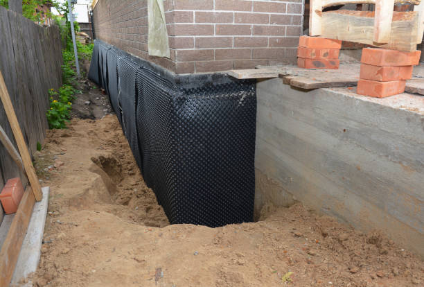 Happy homeowners after waterproofing job in Mecosta
